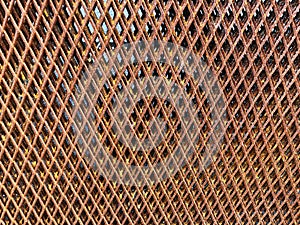 cage rusty metal wire isolated on black background - close up. brown grille pattern isolated on dark background with clipping path