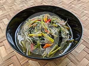 Cah kangkung or tumis kangkung, stir fried water spinach, common asian vegetable dish