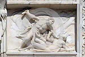 Cain killing Abel, marble relief on the facade of the Milan Cathedral