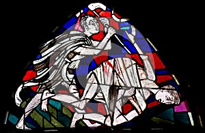 Cain killing Abel in stained glass photo