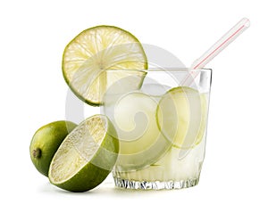 Caipirinha cocktail with lime wedge isolated on white background