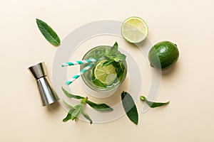 Caipirinha, Mojito cocktail, vodka or soda drink with lime, mint and straw on table background. Refreshing beverage with