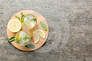 Caipirinha, Mojito cocktail, vodka or soda drink with lime, mint and straw on table background. Refreshing beverage with