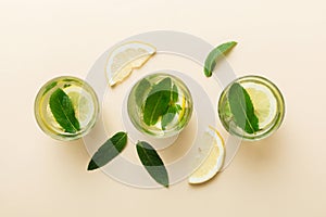 Caipirinha, Mojito cocktail, vodka or soda drink with lime, mint and straw on table background. Refreshing beverage with