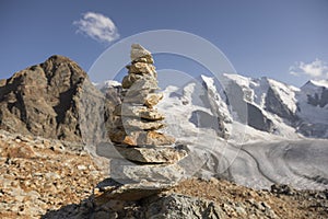 Cairn in the alps with glacier in the background, Switzerland