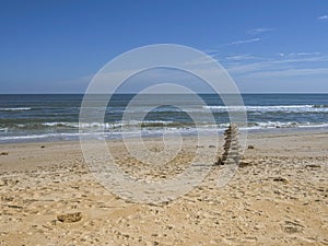 Cairn of Coquina Rocks on the Beach