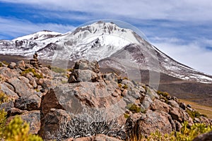 A cairn marks the path along a mountain side in the Sud Lipez province, Uyuni, Bolivia