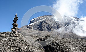 Cairn signaling the way to the summit of Kilimanjaro photo