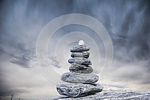 Cairn and Stormy Sky