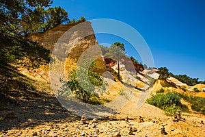 Cairns Formations in front of Colourful Ochres of the French Provencal Colorado in Rustrel France