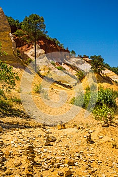 Cairns Formations in front of Colourful Ochres of the French Provencal Colorado in Rustrel France