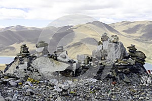 Cairns mark a mountain of the Tibetan Plateau in Brahmaputra Valley of the Tibet Autonomous Region in China.