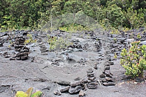 Cairns and plant life on the floor of the Kilauea Iki Crater in Volcanoes National Park, Hawaii