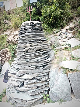 Cairns stones with trishul on top