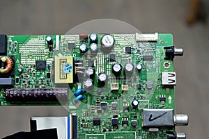 Cairo, Egypt, April 13 2023: interior of LED TV Television main board that contains wires, transformers, resistance, IC and