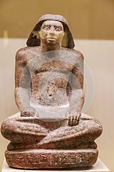 Ancient egyptian statuette in the Museum of Egyptian Antiquities in Cairo, Egypt