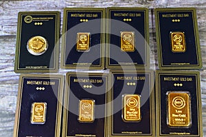 Cairo, Egypt, December 8 2023: 24K karat BTC Bullion Trading Center pure yellow gold of bars and sovereign coin, gold investment,