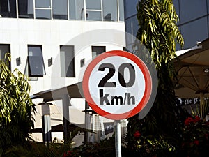 Cairo, Egypt, December 10 2022: A road sign of 20 KMH twenty Kilometers per hour speed limit in the slow lane near gateway,