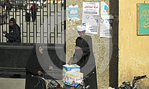 An elderly Arab family. Cairo and its inhabitants. Street photography in Egypt
