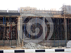 Cairo, Egypt, November 23 2022: A new building that is still under construction in Shinzo Abe axis road in Egypt, the traffic