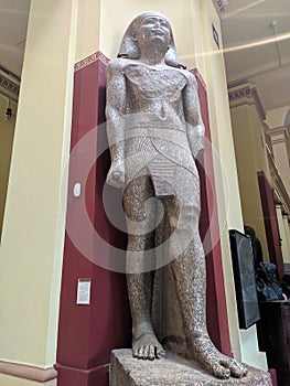 Cairo, Egypt - September 30, 2021: Statue of a pharaoh from the time of ancient Egypt in the Cairo National Museum. Vertical