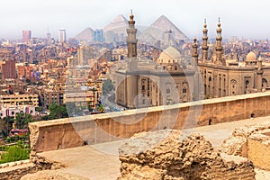 Cairo view, the Mosque-Madrassa of Sultan Hassan and the Pyramids, Egypt