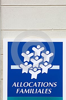 Caisse d'allocations familiales or CAF logo on a wall