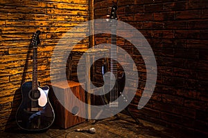 Cajon, bass and acoustic guitar on wooden stage photo