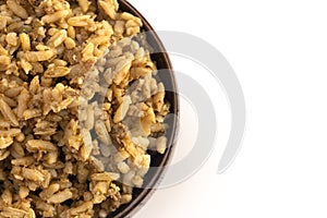 Cajun Dirty Rice in a Wooden Bowl on a White Background