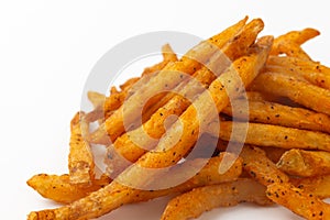 Cajun French fries on a white background