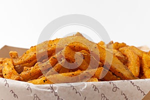 Cajun French fries on a white background