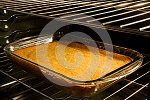 Corn cake baking in oven