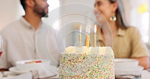 Cake, anniversary or birthday, couple celebrate and romantic together, kiss and love during dinner date. Young, man and