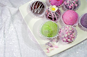 Cake ball on white plate and skull.