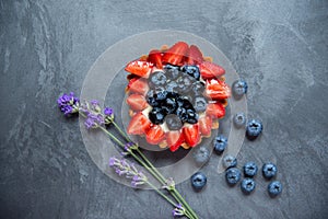 Cake basket with strawberry slices and blueberries. Cake basket