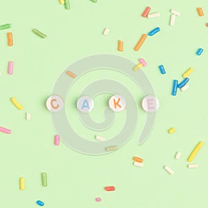 CAKE beads text typography on green