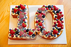 cake with berries in the form of the number ten. photo
