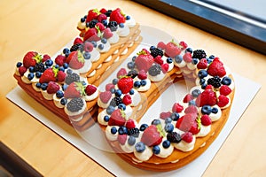 cake with berries in the form of the number ten. photo