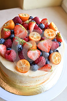 Cake with berries on top.