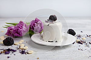 Cake with blackberry and tulip, Valentines Day background. Selective focus