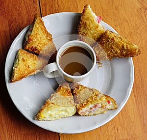 Cake and bread eaten with hot coffee