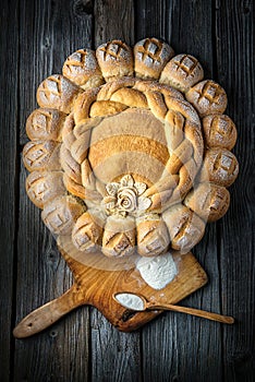 Cake with breadboard on wooden background, picture for bakery or shop