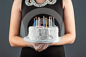 Cake with burning candles close-up. Happy birthday congratulation celebration party anniversary. Copy space