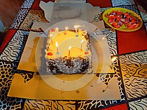 Cake with candles in a birthday celebration function