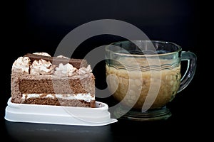 Cake chocolate with water in cup