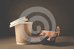 cake with a chocolate stuffing and cappuccino plastic cup/cake with a chocolate stuffing and cappuccino plastic cup on a dark