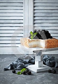 Cake with cream and blackberries