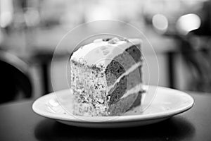 Cake with cream, food. Cake slice on white plate in paris, france, dessert. Temptation, appetite concept. Dessert, food