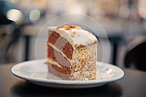 Cake with cream, food. Cake slice on white plate in paris, france, dessert. Temptation, appetite concept. Dessert, food