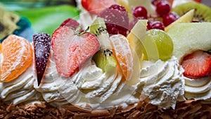 Cake with cream and pieces of fruit